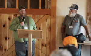 President Pro-Tem Henry Gundlach (right) introduced Larry Watson, B&B Forest products, explaining procurement and demonstrated how he grades logs.